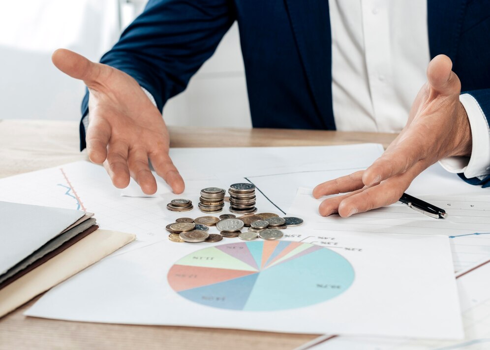 close-up-man-with-coins-statistics_23-2148773975